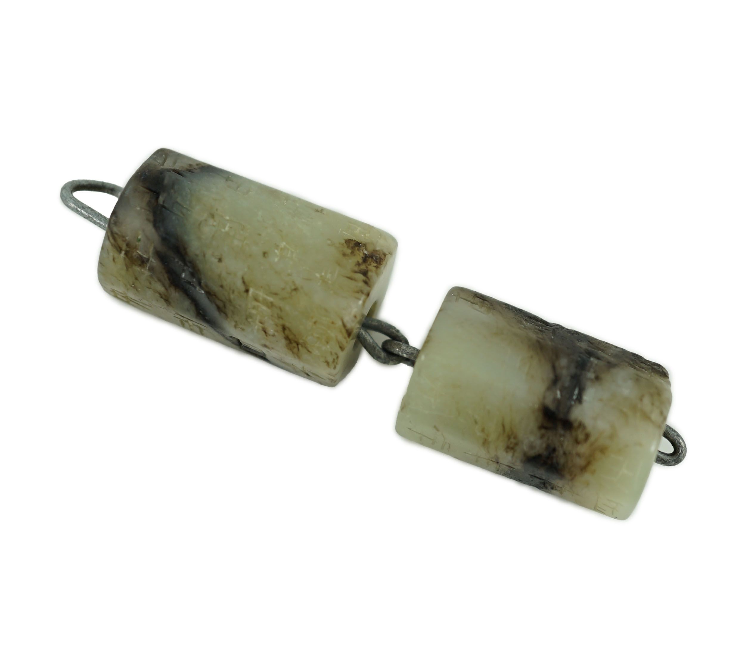 Two Chinese grey and black seal script inscribed jade beads, possibly Han dynasty, largest bead 2.5 cm